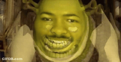 A Close Up Of A Man 'S Face With Shrek Makeup On It . GIF