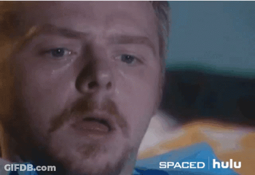 A Close Up Of A Man 'S Face With Spaced Hulu In The Corner GIF