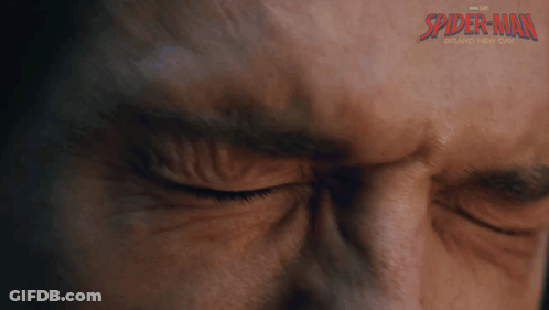 A Close Up Of A Man 'S Face With Spider-Man Written On The Bottom GIF