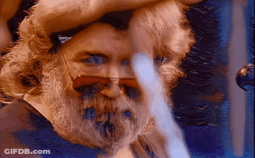 A Close Up Of A Man 'S Face With Sunglasses On GIF