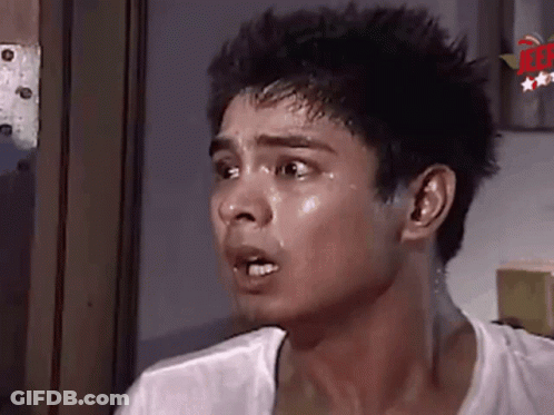A Close Up Of A Man 'S Face With Sweat Coming Out Of His Face And Neck . GIF