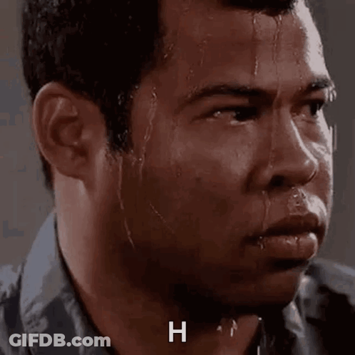 A Close Up Of A Man 'S Face With Sweat Coming Out Of His Face And The Letter H On The Bottom . GIF