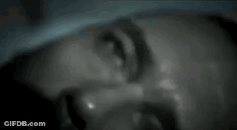 A Close Up Of A Man 'S Face With Sweat Coming Out Of It . GIF