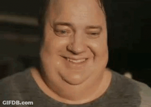 A Close Up Of A Man 'S Face With Sweat On His Face And A Smile . GIF