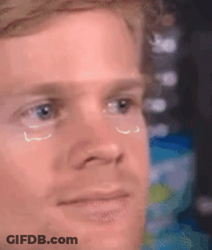 A Close Up Of A Man 'S Face With Tears Coming Down His Eyes . GIF