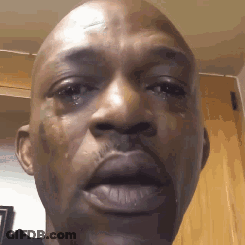 A Close Up Of A Man 'S Face With Tears Running Down His Cheeks GIF