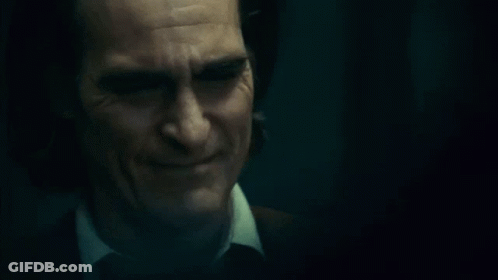 Close Up Man Face With Tears In Dark Room GIF