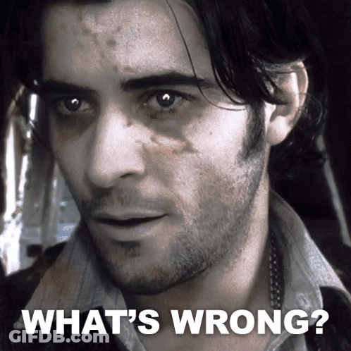 A Close Up Of A Man 'S Face With The Caption " What 'S Wrong " GIF