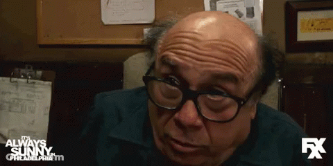 A Close Up Of A Man 'S Face With The Fx Logo In The Background GIF