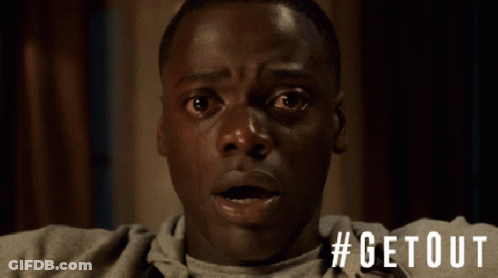 A Close Up Of A Man 'S Face With The Hashtag #Getout On The Bottom GIF