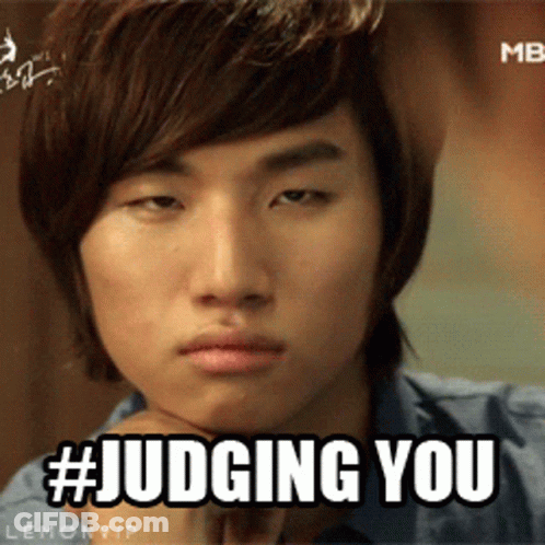 A Close Up Of A Man 'S Face With The Hashtag # Judging You GIF