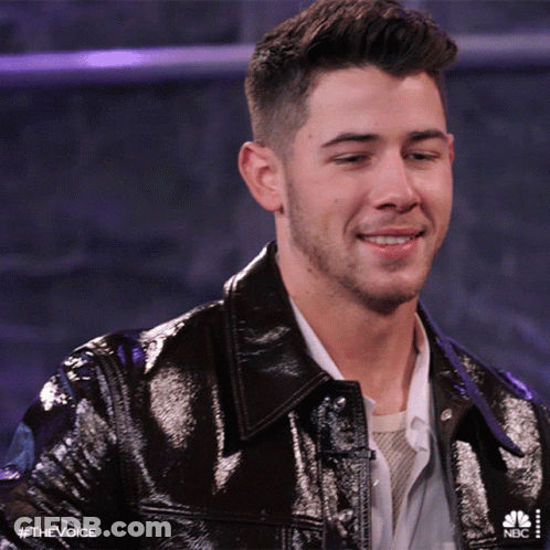 A Close Up Of A Man 'S Face With The Hashtag #Thevoice On The Bottom GIF