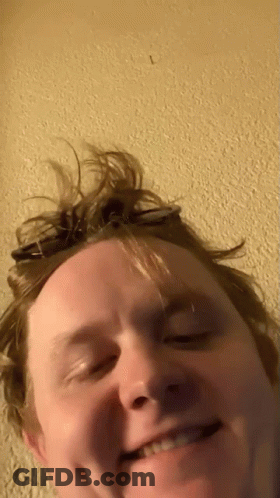 A Close Up Of A Man 'S Face With The Letter L In The Corner GIF