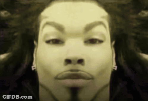 A Close Up Of A Man 'S Face With The Letter P On His Earring GIF