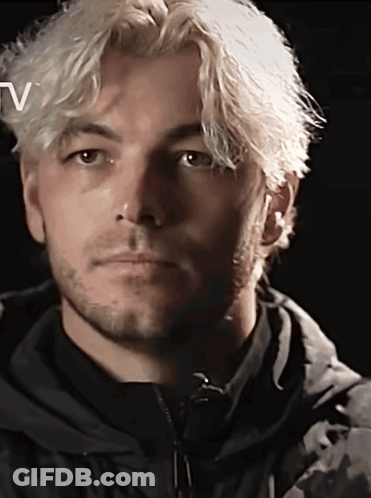 A Close Up Of A Man 'S Face With The Letter V Above Him GIF