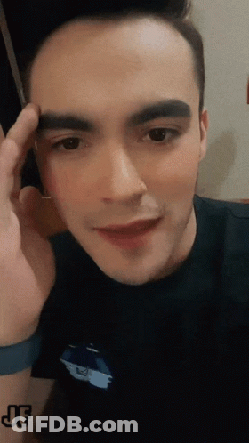 A Close Up Of A Man 'S Face With The Letters Jf On The Bottom GIF