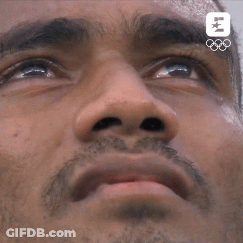 A Close Up Of A Man 'S Face With The Letters Lm On The Bottom Right GIF