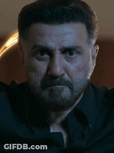 A Close Up Of A Man 'S Face With The Letters St On The Bottom GIF