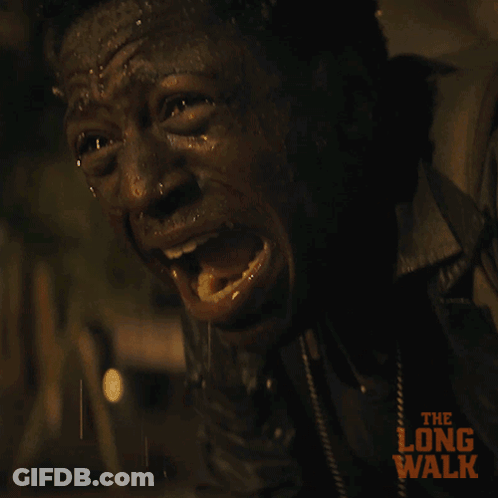 A Close Up Of A Man 'S Face With The Long Walk Written On It GIF