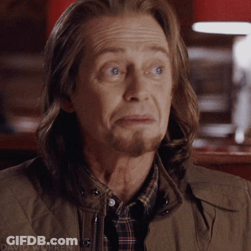 A Close Up Of A Man 'S Face With The Name David Worren Visible GIF