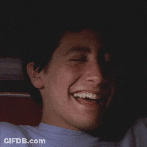 A Close Up Of A Man 'S Face With The Name David Worren Visible GIF