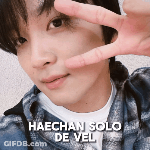 A Close Up Of A Man 'S Face With The Name Haechan Solo De Vel Written Above Him GIF