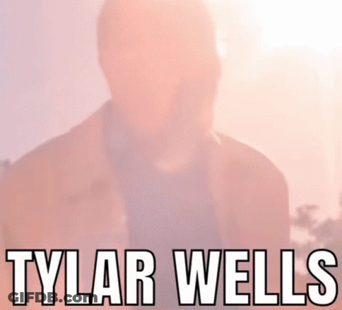 A Close Up Of A Man 'S Face With The Name Tylar Wells Written Above Him GIF