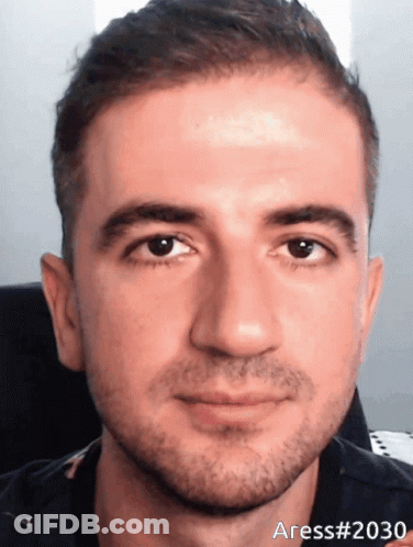 A Close Up Of A Man 'S Face With The Number 2030 On The Bottom GIF
