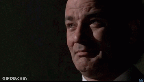 A Close Up Of A Man 'S Face With The Number 8 On The Bottom GIF