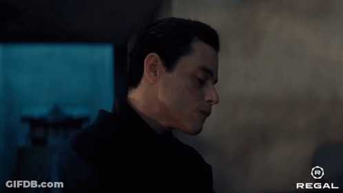 A Close Up Of A Man 'S Face With The Regal Logo In The Corner GIF