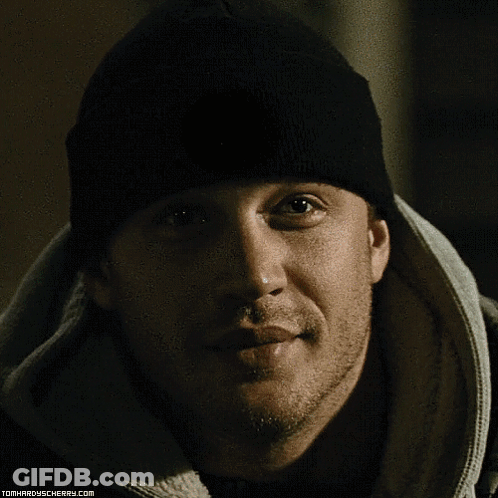 A Close Up Of A Man 'S Face With The Website Tomhardyscherry.com On The Bottom Right GIF