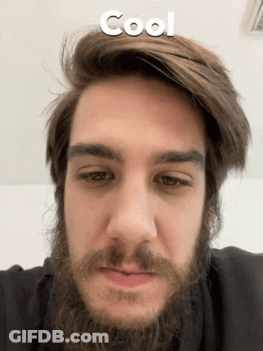 A Close Up Of A Man 'S Face With The Word Cool Written Above Him GIF