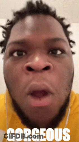 A Close Up Of A Man 'S Face With The Word Gorgeous On The Bottom Right GIF