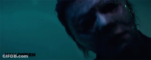 A Close Up Of A Man 'S Face With The Word Halloween On The Bottom Right GIF