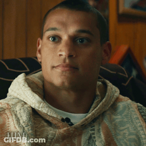 A Close Up Of A Man 'S Face With The Word Him On The Bottom Right GIF