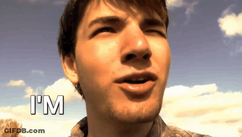 A Close Up Of A Man 'S Face With The Word I 'M Above Him GIF