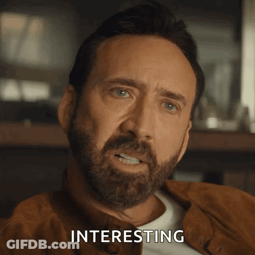 A Close Up Of A Man 'S Face With The Word Interesting Above Him GIF