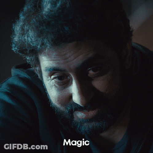 A Close Up Of A Man 'S Face With The Word Magic Underneath GIF