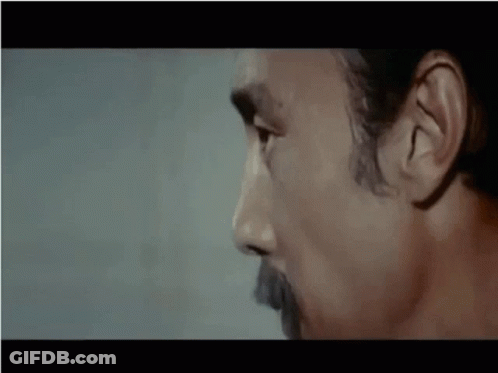 A Close Up Of A Man 'S Face With The Word No In White Letters GIF