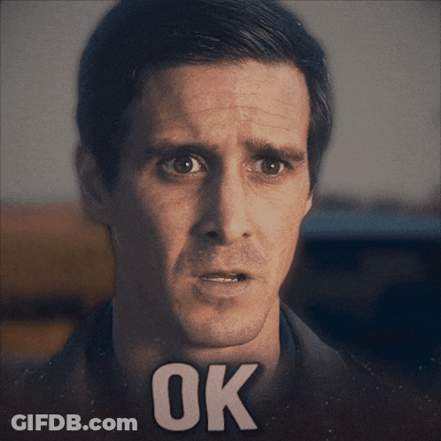 A Close Up Of A Man 'S Face With The Word Ok On His Face GIF