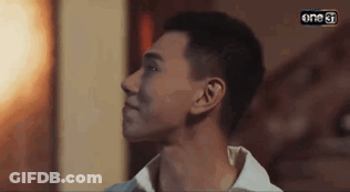 A Close Up Of A Man 'S Face With The Word One On The Bottom Left Corner . GIF