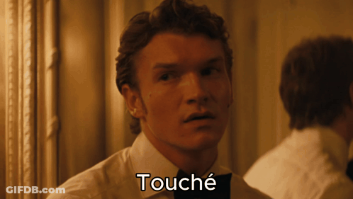 A Close Up Of A Man 'S Face With The Word Touche Below It GIF
