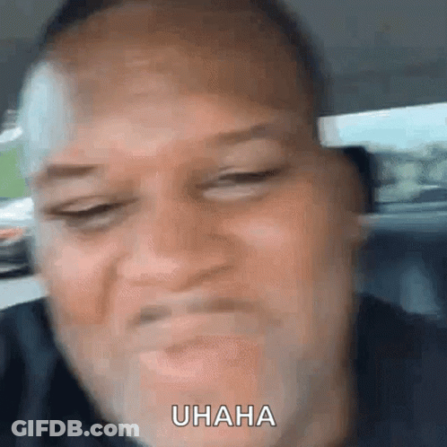 A Close Up Of A Man 'S Face With The Word Uhaha Written On It GIF