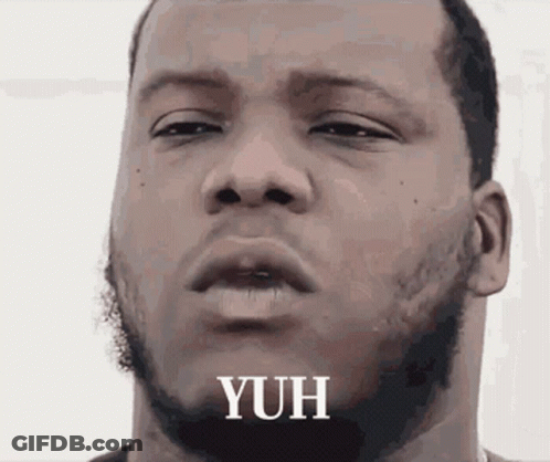 A Close Up Of A Man 'S Face With The Word Yuh Written On It GIF