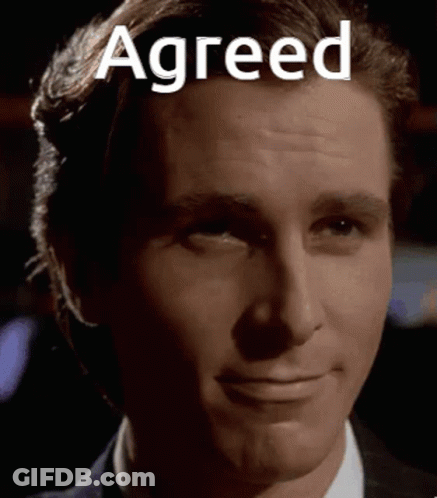 A Close Up Of A Man 'S Face With The Words Agreed Written On It . GIF
