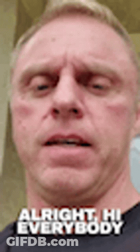 A Close Up Of A Man 'S Face With The Words `` Alright , Hi Everybody '' . GIF