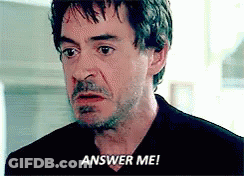 A Close Up Of A Man 'S Face With The Words Answer Me Written On It . GIF