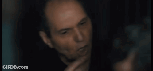 A Close Up Of A Man 'S Face With The Words Are You Stupid Below Him GIF