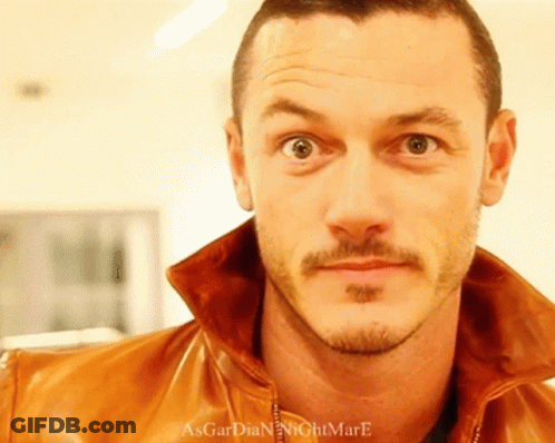 A Close Up Of A Man 'S Face With The Words Asgardian Nightmare Written On The Bottom GIF