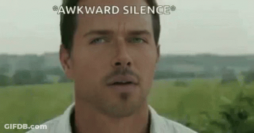 A Close Up Of A Man 'S Face With The Words `` Awkward Silence '' Written On The Bottom . GIF